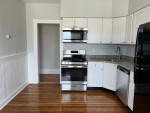 Modern kitchen in newly remodeled 2Bed 1Bath apartment with stainless steel appliances and granite countertops.