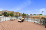Sundeck area with seating overlooking Washington DC, ideal for relaxation in Park Crescent Apartments.