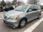 2009 Honda Odyssey EXL minivan in good mechanical condition, slight exterior dents, used for personal and business.