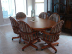 Oak Oval Pedestal Dining room Table with 2 leaves.