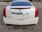 Rear view of a 2013 Cadillac CTS 4 AWD in pearl white, parked in a lot with professional maintenance details.