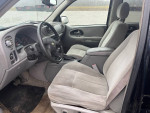 Interior view of a 2005 Chevrolet TrailBlazer with clean seats and dashboard, ready for sale.