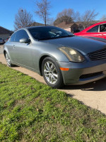 2005 Infiniti G35 coupe with clean title and strong performance, parked on grass.