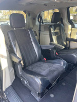 Interior view of well-maintained 2014 Chrysler Town & Country minivan with black seats.