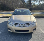 2011 Toyota Camry in great condition with low mileage and clean CARFAX, parked in a sunny area