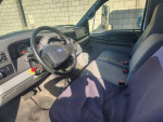Interior view of a 2007 Ford F-650 XLT with grey seats and dashboard showing a clean condition.