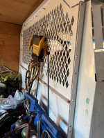 Interior of a 2005 E250 work van showing equipment and cargo space, ready for work in Fort Mill, SC.