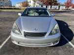 Front view of a 2005 Lexus ES 330, silver color, parked in a lot, showcasing its clean lines and headlights.