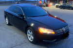 2013 Volkswagen Passat SE FWD in black color, featuring clean title and diesel engine, parked at a gas station.