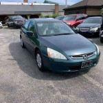 Honda Accord in a parking lot, featuring automatic drive and tinted windows, priced with financing options.