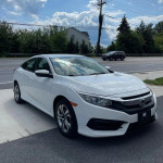 2017 Honda Civic Sport with 65,875 miles, fuel-efficient and in excellent condition, parked on the road