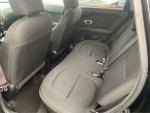Interior view of a 2015 Kia Soul showing the spacious back seat area with black upholstery.