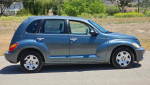 Side view of a blue 2006 Chrysler PT Cruiser Wagon with gray interior and 147,412 miles for sale.