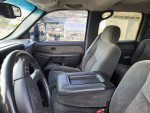 Interior view of a 2003 Chevrolet Silverado 2500HD showing front seats and dashboard in good condition.