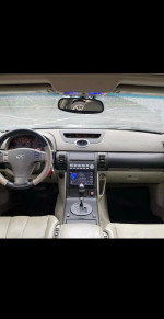 Interior view of a 2003 Infiniti G35 with clean design and focused dashboard features