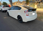 2012 Toyota Prius Four parked on street, clean title, great condition, averaging 47-50 mpg