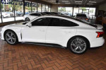 2022 Audi e-tron GT Premium Plus in Ibis White with black interior, showcasing sleek design inside a dealership.