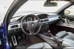 Interior view of a 2008 BMW M3 coupe featuring a sleek dashboard and leather seats.