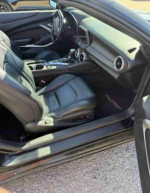 Interior view of a 2017 Chevrolet Camaro 1LS showcasing premium leather seats and modern dashboard design.