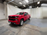 Red Chevrolet Silverado 1500HD Classic pickup truck showcasing powerful design, advanced safety features, and towing capabilities.