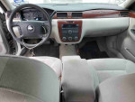 Interior view of a 2006 Chevrolet Impala LS showing dashboard and seating, ideal for everyday use.