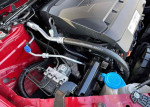 Engine compartment of a 2014 Honda Accord EX, showcasing clean mechanics and components in red and black.