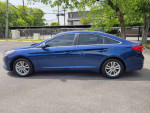 2016 Nissan Maxima 3.5 SR parked outdoors, showcasing its sleek blue exterior and stylish design.