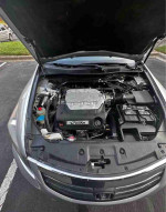 Under the hood of a 2012 Honda Accord EX-L V-6 showing the engine and components.