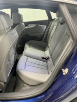 Interior view of the rear seats in a 2018 Audi A5 Sportback with premium leather in excellent condition.
