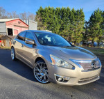 2015 Nissan Altima 2.5 SL in excellent condition with custom chrome wheels parked outdoors