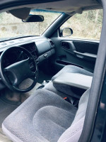 Interior view of a 1997 Dodge Dakota showing the driver's seat and dashboard details.