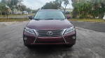 Front view of a 2015 Lexus RX 350 in pristine condition for sale, showcasing its sleek design and low mileage.