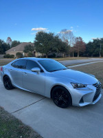 2017 Lexus IS200t in excellent condition parked on driveway, showcasing sleek design and exterior features.