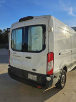 Reliable insulated Ford T250 delivery van for work or conversion, well-maintained with high mileage.