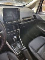 Interior view of a 2020 Ford EcoSport Titanium, featuring touchscreen, leather seats, and modern console design.