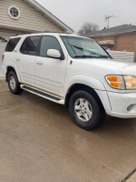2002 Toyota Sequoia 4x4 parked in driveway, garage kept, 136,000 miles with service records.