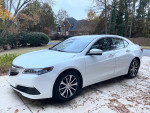 2017 Acura TLX Technology Package in great condition with alloy wheels and minor scratches, parked outside.