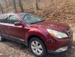 2011 Subaru Outback for sale with 139,000 miles, reliable condition, minor scuff on the rear bumper.