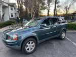 2007 Volvo XC90 3.2 AWD in blue, showcasing its clean exterior, tinted windows, and sunroof.