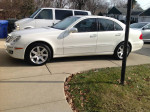 2007 Mercedes-Benz E350 4-Matic sedan parked on driveway, featuring white exterior and saddle interior.