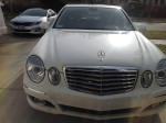 Front view of a 2007 Mercedes-Benz E350 4-Matic sedan in white, showcasing its sleek design and features.
