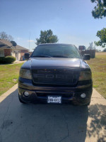 Front view of a 2007 Ford F-150 Harley-Davidson, low miles, dark amethyst color, for sale in good condition.