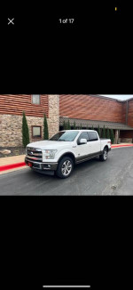 2017 Ford F150 King Ranch Supercab 4x4 parked outside, showcasing its well-maintained exterior and off-road tires.