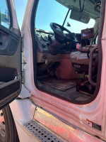 Interior view of a 2016 Freightliner Cascadia truck with automatic transmission and modern features.