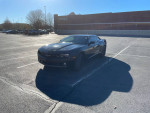 2010 Chevrolet Camaro RS parked in a lot, featuring automatic windows and new tires.