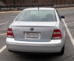 2004 Volkswagen Jetta TDI rear view, showing alloy wheels and clean condition, parked in a lot.