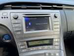 Interior dashboard of a 2012 Toyota Prius Five showing Bluetooth audio controls and climate settings.