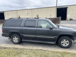 Chevrolet Suburban parked outside, reliable family vehicle with good mechanical condition and clean CarFax.
