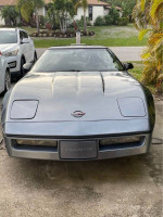 Front view of a 1990 Chevrolet Corvette in Steel Blue Metallic, highlighting its classic design and excellent condition.