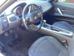 Interior view of a 2006 BMW Z4 with clean seats, steering wheel, and controls.